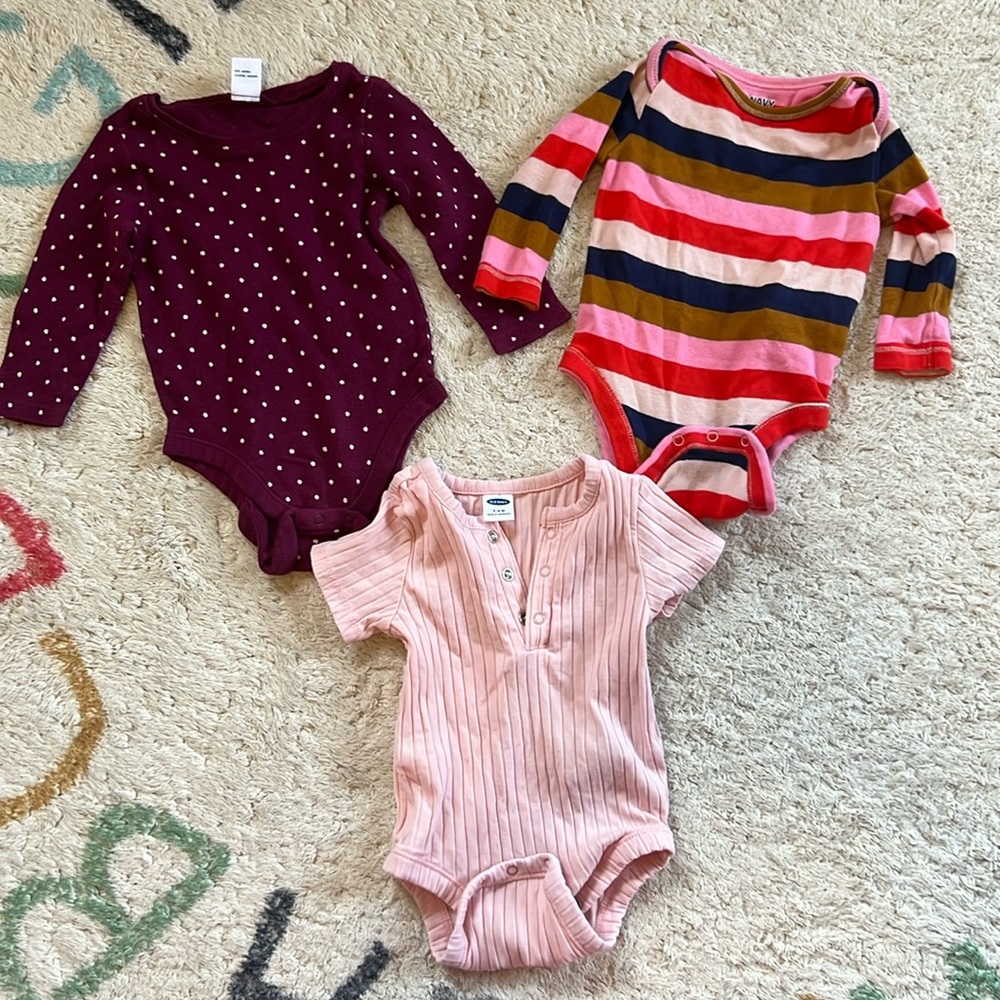 3 Old Navy baby girl bodysuits (1 short sleeve, 2 long sleeve). All size 3-6M